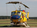 VH-SUH @ YLTV - Telephoto Front Portside view of cabin of McDermott Aviation Bell 214B-1 VH-SUH Cn 28017 HeliTack 339, at Latrobe Valley Airport (YLTV) Morwell on 22Feb2015. Fitted with a ‘HeliLift’ water/ fire retardant tank under the cabin. - by Walnaus47