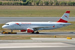 OE-LBI @ LOWW - Being towed to parking - by Robert Kearney