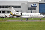 N999AA @ EINN - Parked up before its return flight - by Robert Kearney