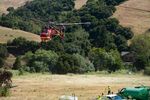 N4035S - Assisting with the movement of equipment to shore up a persistent mud slide in Castro Valley California. - by Chris Humphrey