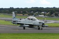 13-2011 @ EGPK - Afghan AF A-29 Super tucano taxiing for departure at Prestwick, did you notice the Pink Panther in the back seat? - by Douglas Connery