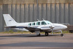 VH-KEW @ YBAS - Parked at YBAS Alice Springs NT operated by Chartair Pty LTD - by Jason Stray