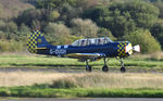 G-OUGH @ EGFH - Resident Yak-52 arriving Runway 28. - by Roger Winser