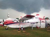 N995MF @ KOSH - Menacing clouds forming at KOSH - by J. R. Riggs