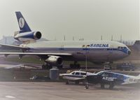 OO-SLC @ EBBR - Walking a DC10 EBBR taxiway A scan from slide - by j.van mierlo
