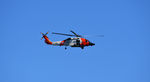 6004 - MH-60 out of Elizabeth City flies down the Outer Banks coastline. - by spike69