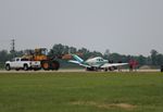 N9736R @ KOSH - EAA OSH 2019 - Bonanza got caught in the wake of a landing Ford Trimotor making for a hard landing damaging the main gear, shutting down the runway for 45 min. - by Florida Metal