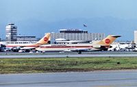 N574PE @ KLAX - Continental 727 landing 25L at LAX from Houston -photo from the Imperial terminal parking lot - by Tom Vance