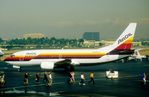 N309AC @ KSNA - AirCal B733 taxiing out while debarking pax walk past! - by FerryPNL
