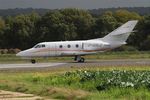 F-GSLZ @ LFRU - Dassault Falcon 10, Taxiing, Morlaix-Ploujean airport (LFRU-MXN) - by Yves-Q