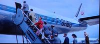 F-BHBD @ NYI - Passengers boarding at New York International Airport 1957 - by Scene from the movie 'Let's Be Happy' (1957)