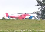 G-DRNT @ EGSH - 40 year old Sikorsky photographed between the trees on the approach road to the Norwich Aviation Museum and looking its age.