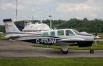 C-FEUW @ CYRO - Beech Bonanza taxiing off the ramp at CYRO after getting fuel - by yow_aviation