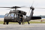 86-24498 @ KOQU - RI ARNG Blackhawk picking up media - by Topgunphotography