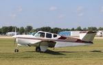 N3853B @ KOSH - Beech F35