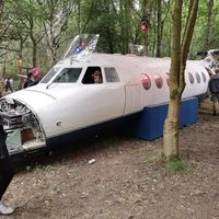 G-JXTA @ N/A - Now used as a prop at an abandanded airport themed area of a music festival. - by S. Marflitt