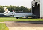 F-HHED @ EHLE - Metamorphosis in progress by Satys (aircraft painting) . Through other activities inside the Satys hangar the Falcon outside for just a breath of fresh air - by Jan Bekker