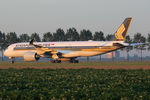 9V-SMR @ EHAM - at spl - by Ronald