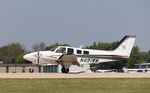 N491WM @ KOSH - Beech 58P - by Mark Pasqualino