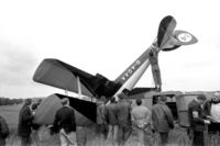 G-AOAA - This aircraft had been flying with a 'wing-walker' in very gusty weather at Audley End air show circa 1970/71. The plane was caught by the wind as it taxied after the display and flipped. Bill Ison, then CFI at Cambridge Flying Group is far right in shot. - by Andrew Houston