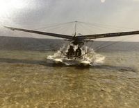 N4565C - On the Pensacola Beach with my aluminum floats in my T38 aerobatic BR503. - by Donna M Ciano