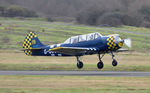 G-OUGH @ EGFH - Resident Yak-52 departing Runway 28. - by Roger Winser