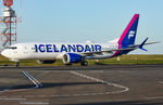 TF-ICU @ EGSH - On Tug To Stand After Respray Into New Icelandair Livery. This Design With The Pink/Purple Tail. - by Josh Knights