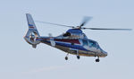 G-MFLT @ EGFH - Visiting helicopter departing Runway 04. - by Roger Winser