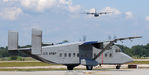 94-00308 @ KOQU - Sherpa holding short of taxiway Alpha while Herc Demo is inbound - by Topgunphotography