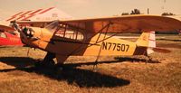 N77507 - I did my solo in this aircraft in 1972.  Harry McCandless was the FBO and you can see the picture of his operation in the background.  Harry died in the mid 80's and his South Omaha airfield closed in 1986.  Off the Jeppesen charts in 1999. - by Ken Coulter