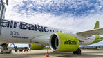 YL-AAU @ ENBR - Closeup of the 100th Airbus A220 logo. Beautiful sky for the photo!