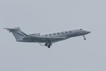N542AP @ EGJB - On approach for 27 at Guernsey (distant shot) - by alanh