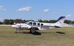 N722AG @ KOSH - Beech 58 - by Mark Pasqualino