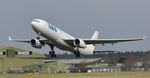 TC-MCN @ EGHH - Lifting off runway 26 - by John Coates