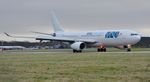 TC-MCN @ EGHH - Arriving on runway 26 - by John Coates