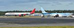 9H-NHS @ EGHH - Awaiting duty with G-TAWX - by John Coates
