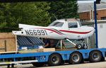 N66991 @ EGHH - Getting a lift - by John Coates
