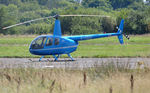 G-CEUU @ EGFH - Visiting R44 helicopter. - by Roger Winser