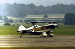 G-BADW @ EGCD - Pitts S-2A of the Rothmans aerobatic display team preparing for action at the 1973 Royal Air Force Association Airshow at Woodford. - by Peter Nicholson