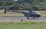 G-REGL @ EGFH - Visiting R44 Raven II helicopter operated by HFM Consulting Ltd. - by Roger Winser