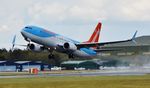 G-FDZY @ EGHH - Wet departure - by John Coates