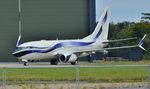 VQ-BLX @ EGHH - At Gama Avn. - by John Coates