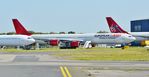 9H-PPE @ EGHH - Parked next to 2-EALK ex Scarlet Lady G-VRED - by John Coates