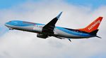 G-TAWV @ EGHH - Climbing away from 26 - by John Coates