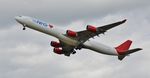 9H-EAL @ EGHH - Climbing away from 26 - by John Coates