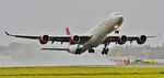 9H-PPE @ EGHH - Wet departure from 26 - by John Coates