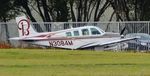 N3084M @ EGHH - Distant shot of parked visitor - by John Coates