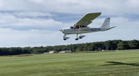 N323TA @ MD35 - N323TA landing at Spring Hill Airport - by V. Catlin