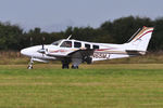 N65MJ @ EGFH - Visiting Baron arriving Runway 22. - by Roger Winser