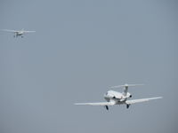 N510LL @ 1938 - Climbing out behind on the left runway behind aircraft on the right runway - by 30295